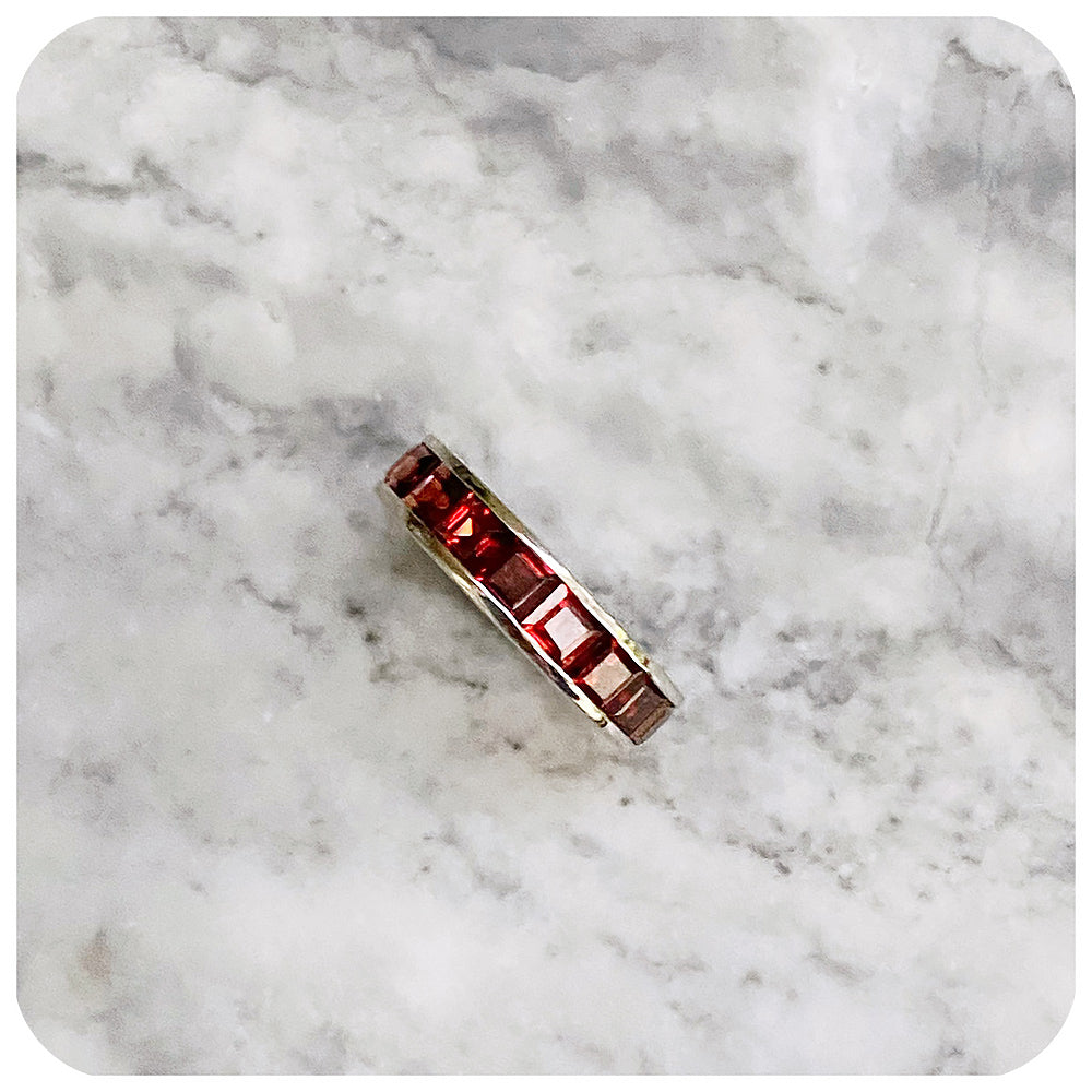 Princess cut Garnet Half Eternity Channel Ring