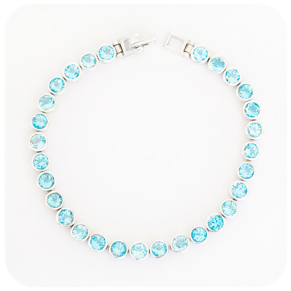 Round cut Swiss Blue Topaz Tennis Bracelet in Sterling Silver