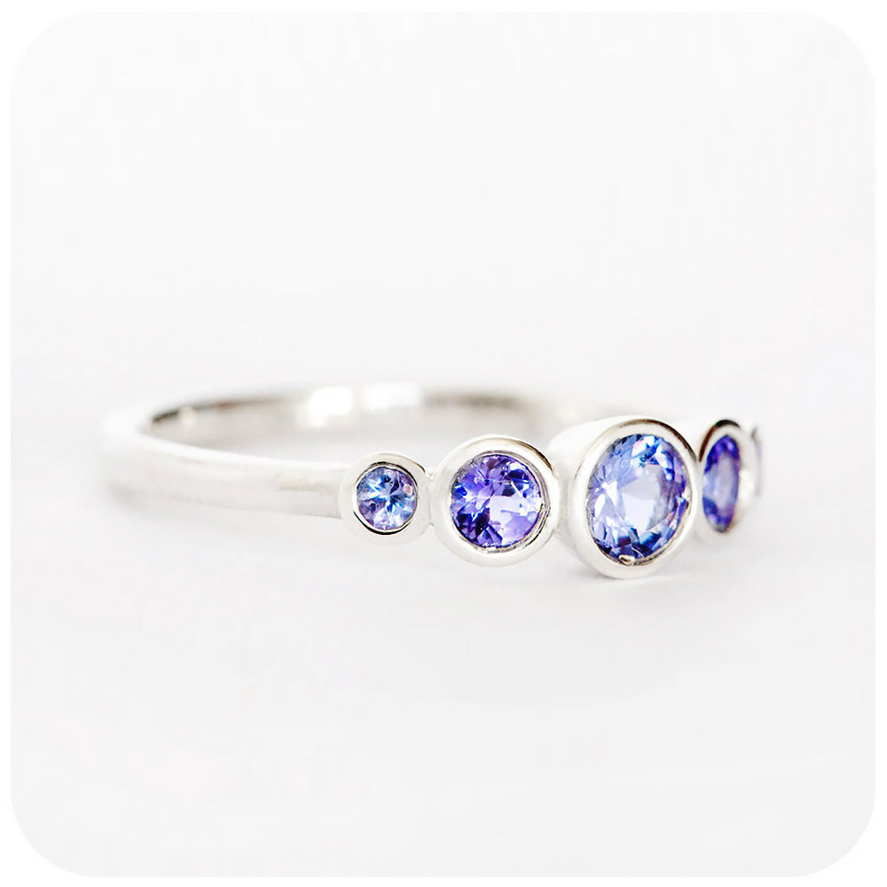 round cut tanzanite half eternity ring with graduated stones - Victoria's Jewellery