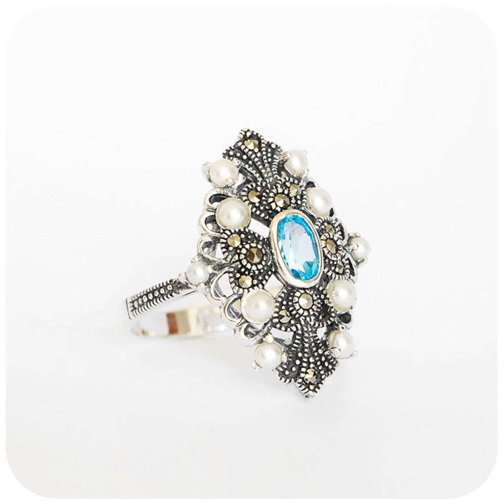 oval cut blue topaz and fresh water pearl vintage inspired ring