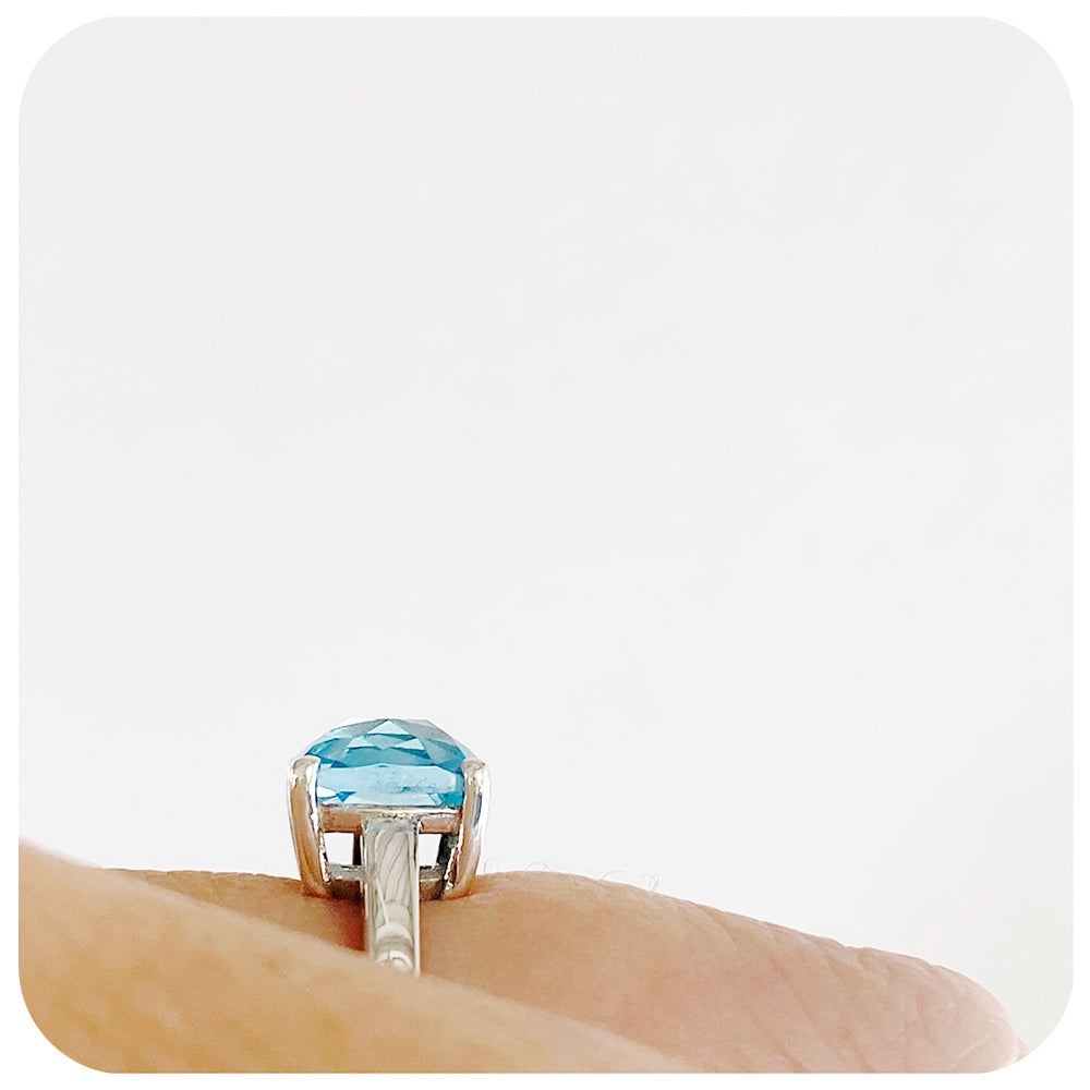 Cushion cut Sky Blue Topaz Solitaire Ring in Sterling Silver