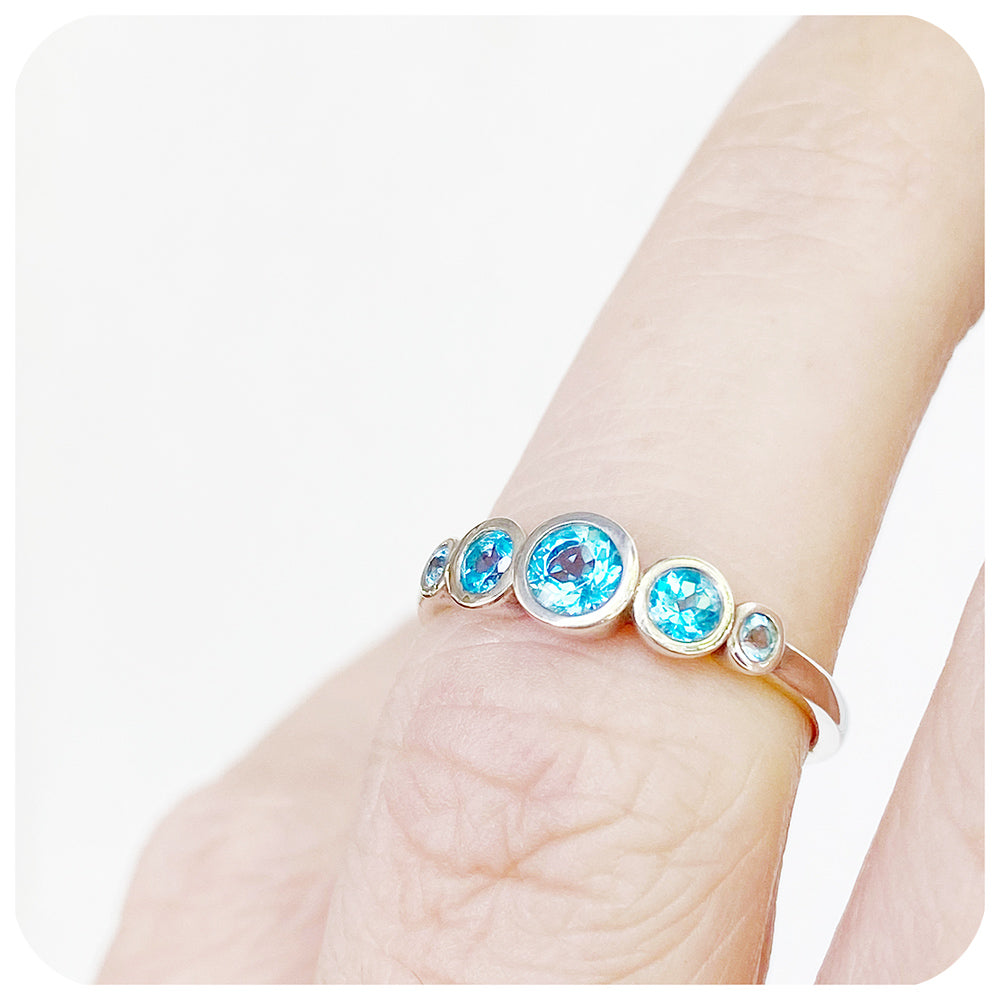 Gabriella, a Swiss Blue Topaz Half Eternity Ring