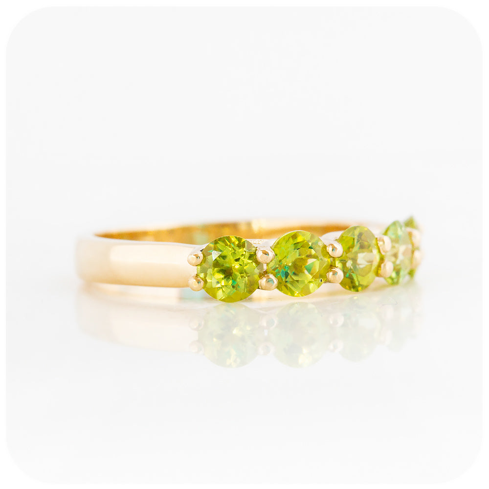 Danelle, a Peridot Half Eternity Trellis Ring