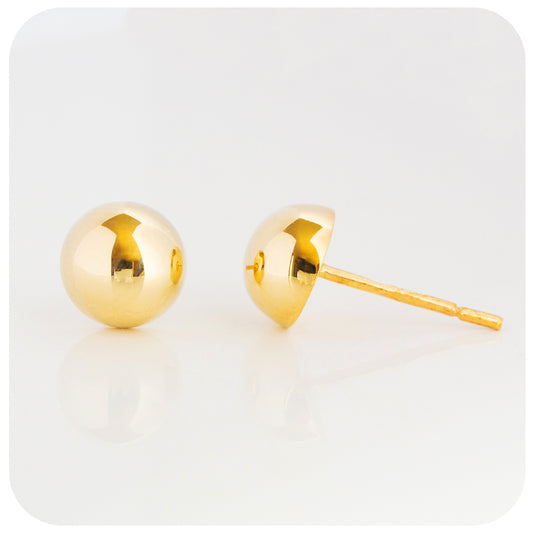 yellow gold dome shape stud earrings