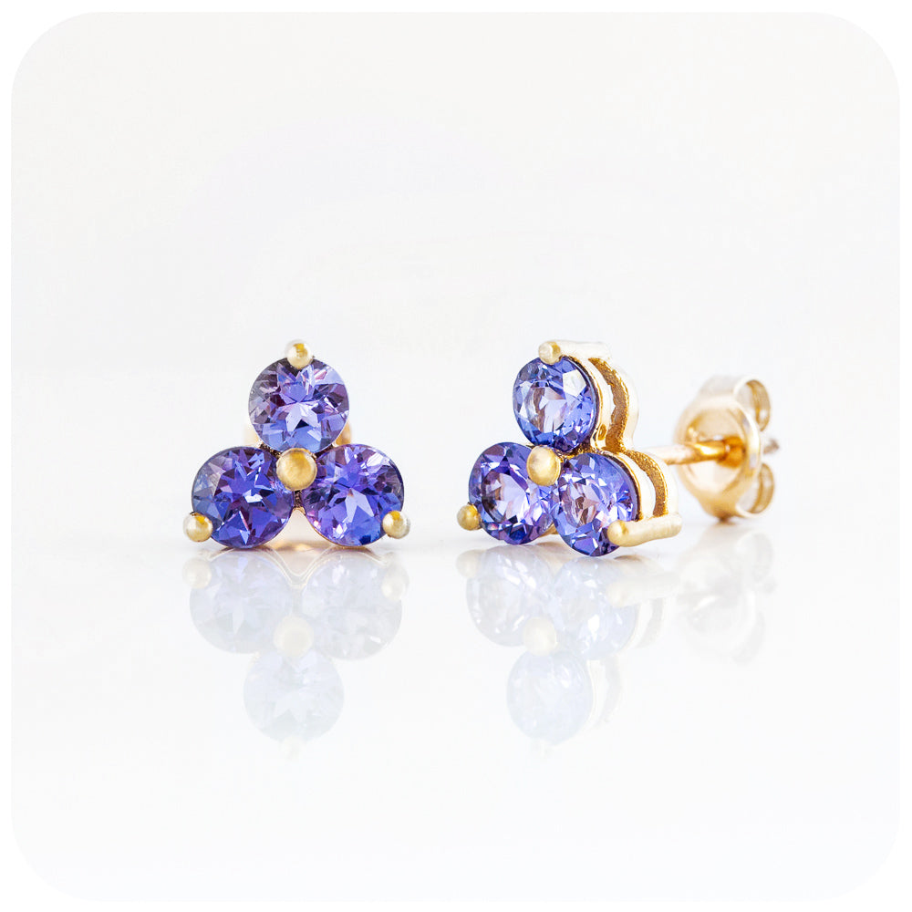 brilliant cut tanzanite trilogy stud earrings in rose goldbrilliant cut tanzanite trilogy stud earrings in yellow gold