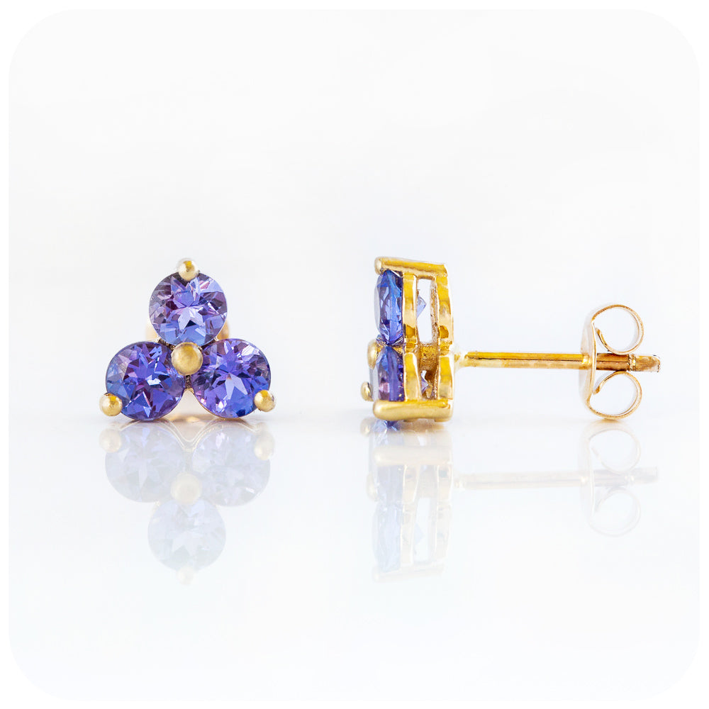 brilliant cut tanzanite trilogy stud earrings in rose goldbrilliant cut tanzanite trilogy stud earrings in yellow gold