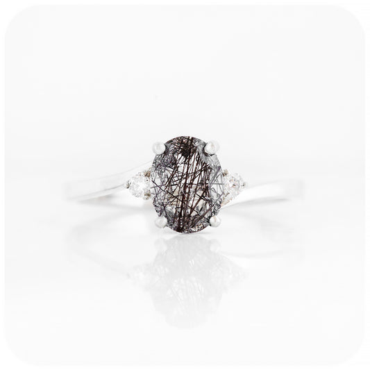 Oval cut Black Rutile and Moissanite Trilogy Ring with a Twist - 8x6mm
