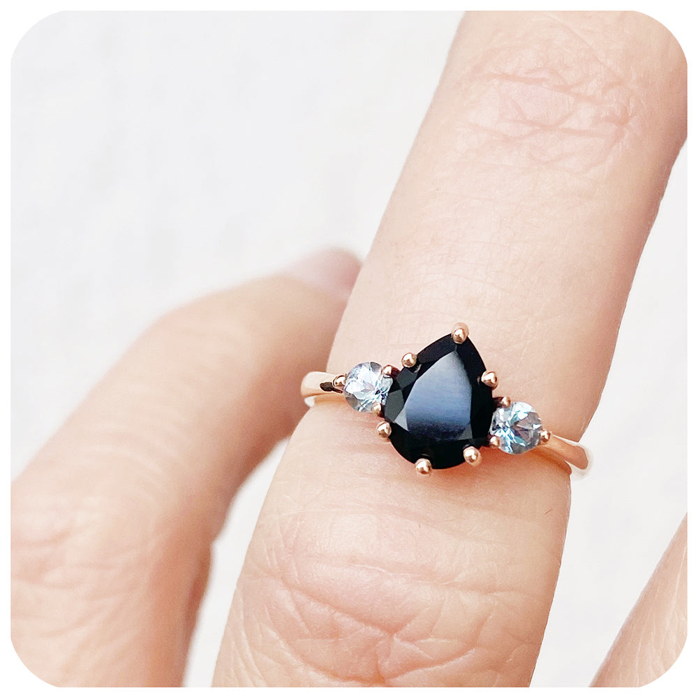 black pear cut spinel and round cut aquamarine trilogy style engagement ring in rose gold - Victoria's Jewellery