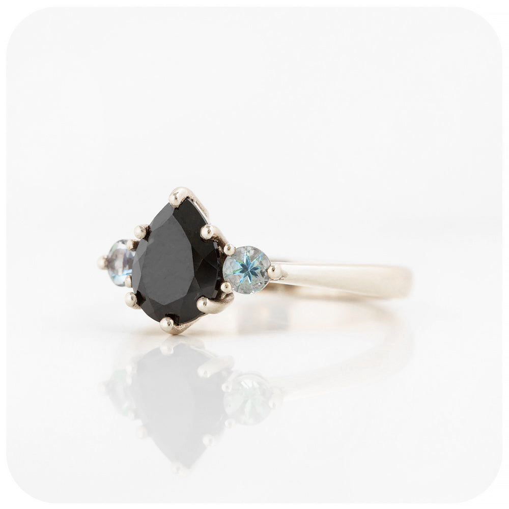 black pear cut spinel and round cut aquamarine trilogy style engagement ring in white gold - Victoria's Jewellery