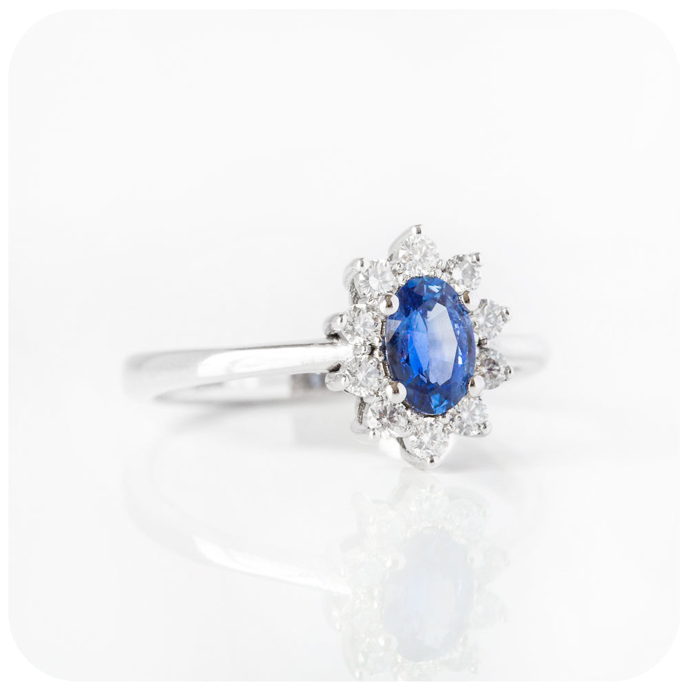The oval cut Blue Sapphire and Diamond Halo Ring