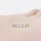 Zelrese, a Mined Diamond Half Eternity Ring