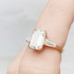 Carmen, an Emerald cut Trilogy Ring