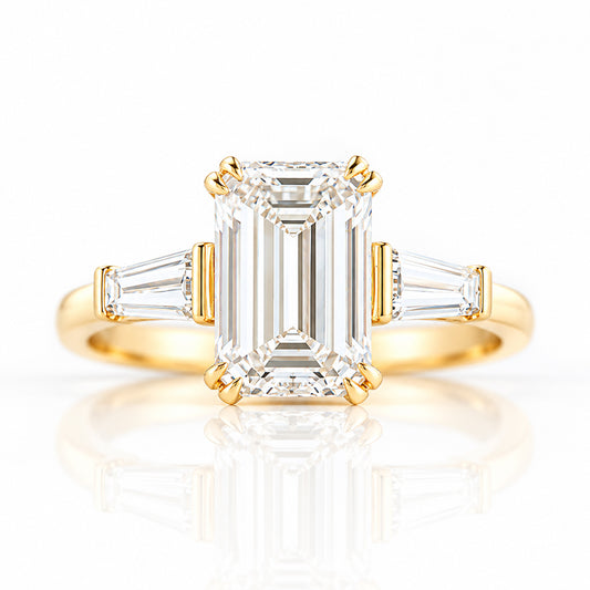 Carmen, an Emerald cut Trilogy Ring