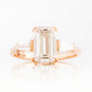 Carmen, an Emerald cut Trilogy Ring