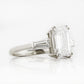 Carmen, an Emerald cut Trilogy Ring