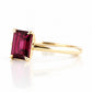 Mari, an Emerald cut Rhodolite Solitaire Ring