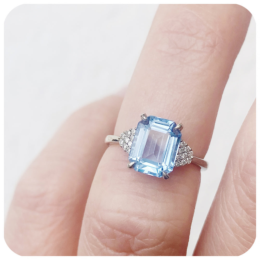 emerald cut blue topaz and moissanite engagement ring in a vintage style - Victoria's Jewellery