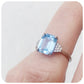 emerald cut blue topaz and moissanite engagement ring in a vintage style - Victoria's Jewellery