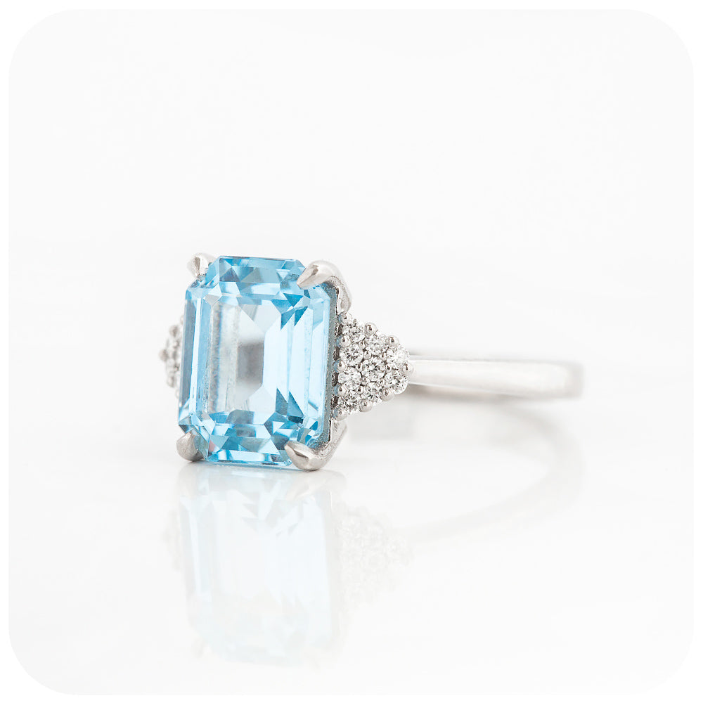 emerald cut blue topaz and moissanite engagement ring in a vintage style - Victoria's Jewellery