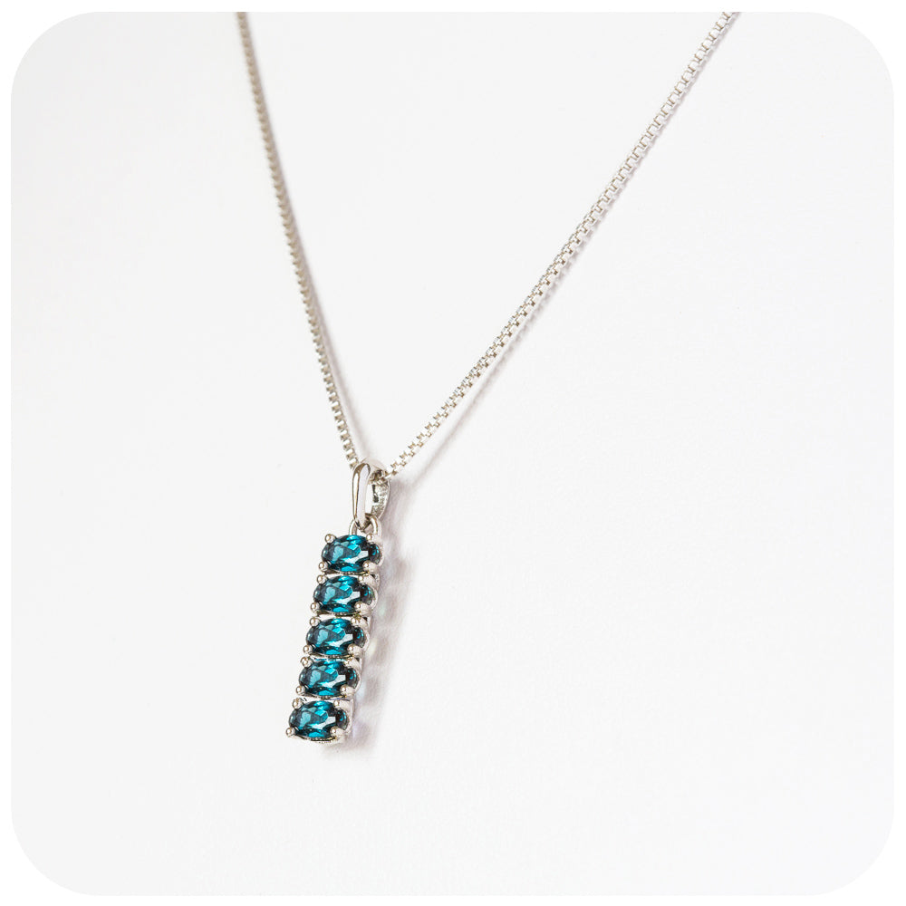 teal london blue topaz oval cut eternity pendant