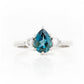 Pear cut London Blue Topaz and White Sapphire Trilogy Engagement Ring in White Gold - Victoria's Jewellery