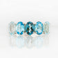Oval cut Blue Topaz Rainbow half eternity ring - Victoria's Jewellery
