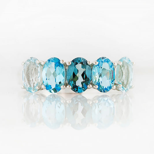 Oval cut Blue Topaz Rainbow half eternity ring - Victoria's Jewellery