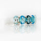 Oval cut Blue Topaz Rainbow half eternity ring - Victoria's Jewellery