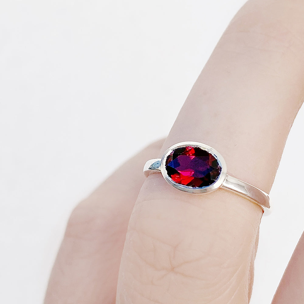 Quinn, an Oval cut Garnet Stack Ring