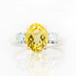 Hallie, an Oval cut Lemon Quartz and Topaz Trilogy Ring