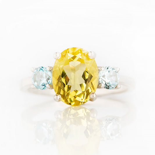Hallie, an Oval cut Lemon Quartz and Topaz Trilogy Ring