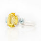 Hallie, an Oval cut Lemon Quartz and Topaz Trilogy Ring
