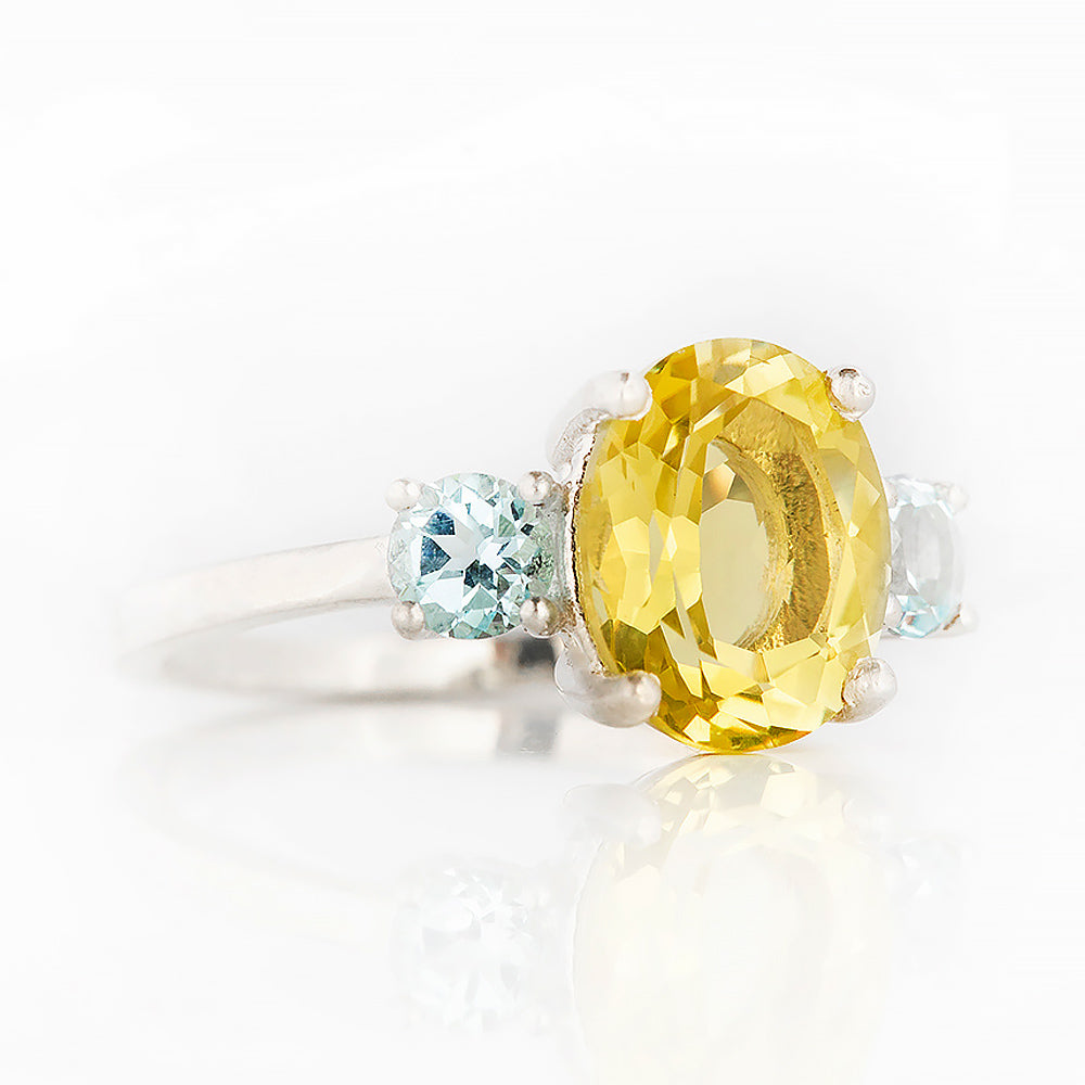 Hallie, an Oval cut Lemon Quartz and Topaz Trilogy Ring