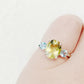 Hallie, an Oval cut Lemon Quartz and Topaz Trilogy Ring