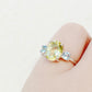 Hallie, an Oval cut Lemon Quartz and Topaz Trilogy Ring