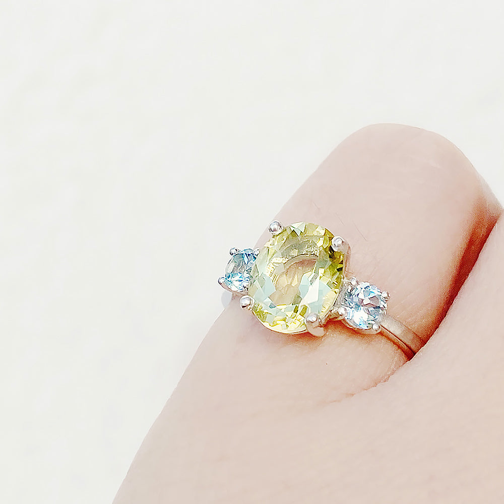 Hallie, an Oval cut Lemon Quartz and Topaz Trilogy Ring