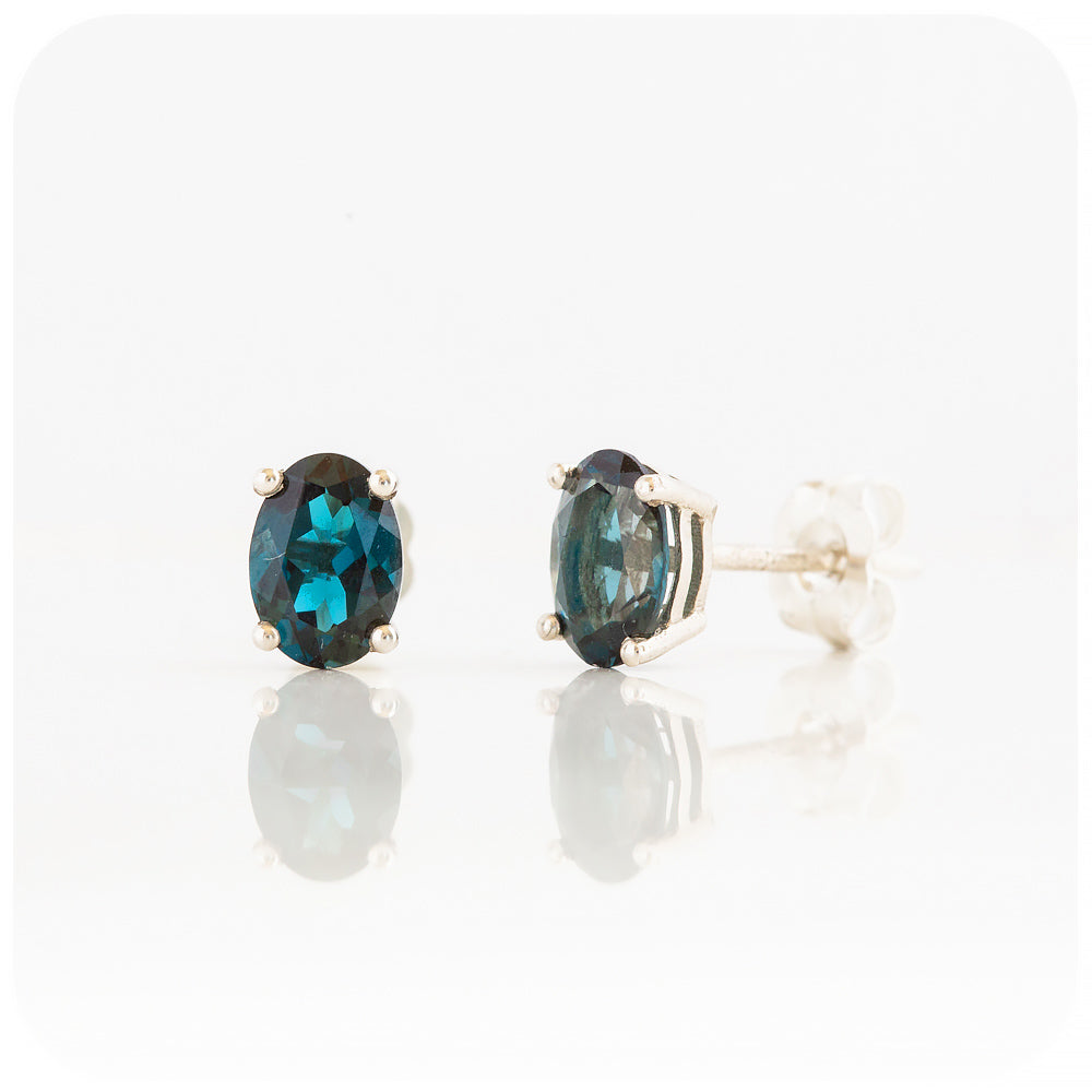 oval cut teal london blue topaz stud earrings in sterling silver