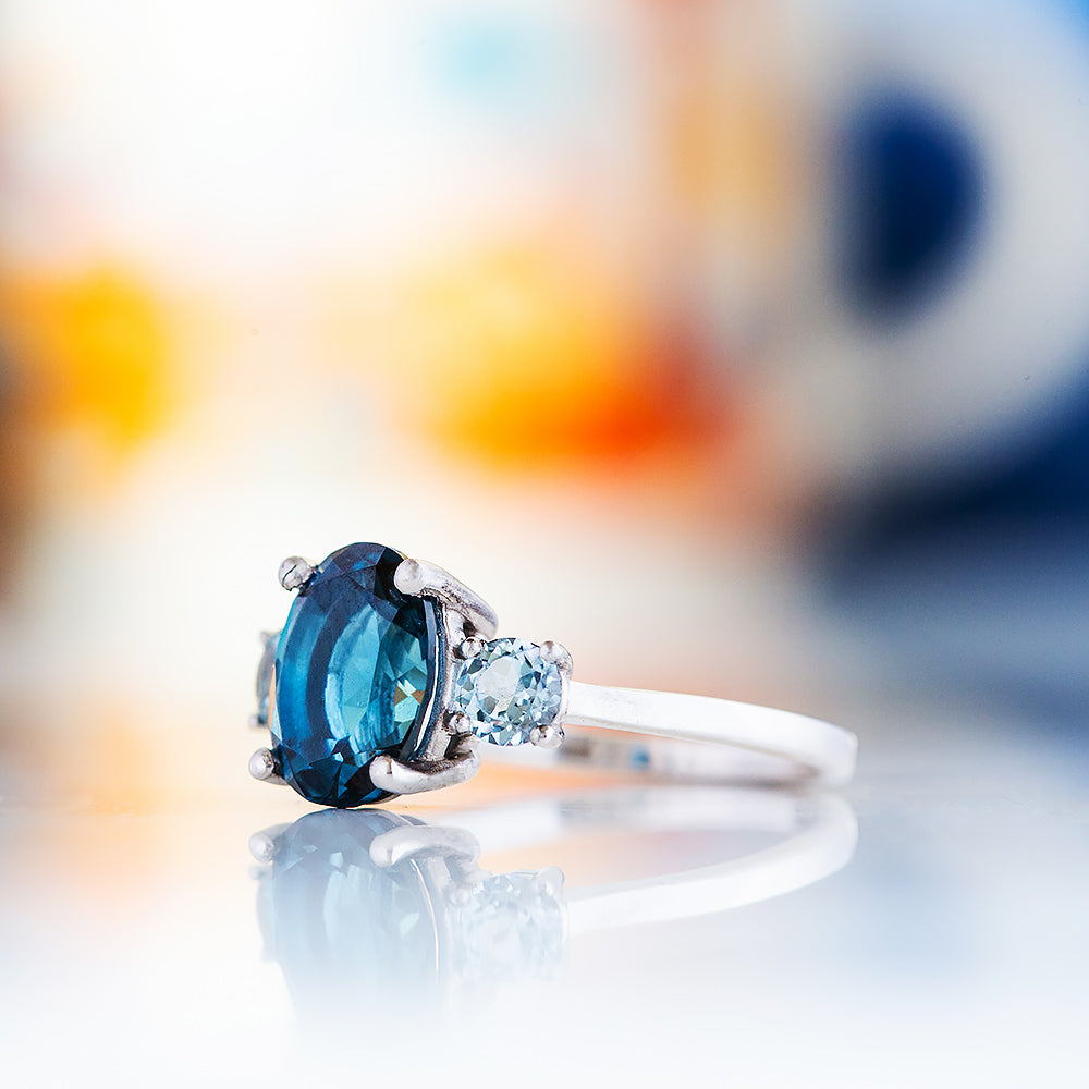 Hallie, an Oval cut London Blue and Sky Blue Topaz Trilogy Ring