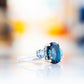 Hallie, an Oval cut London Blue and Sky Blue Topaz Trilogy Ring