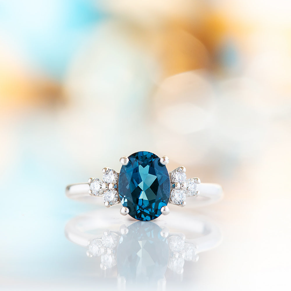 Este, an Oval cut London Topaz and Lab Diamond Ring