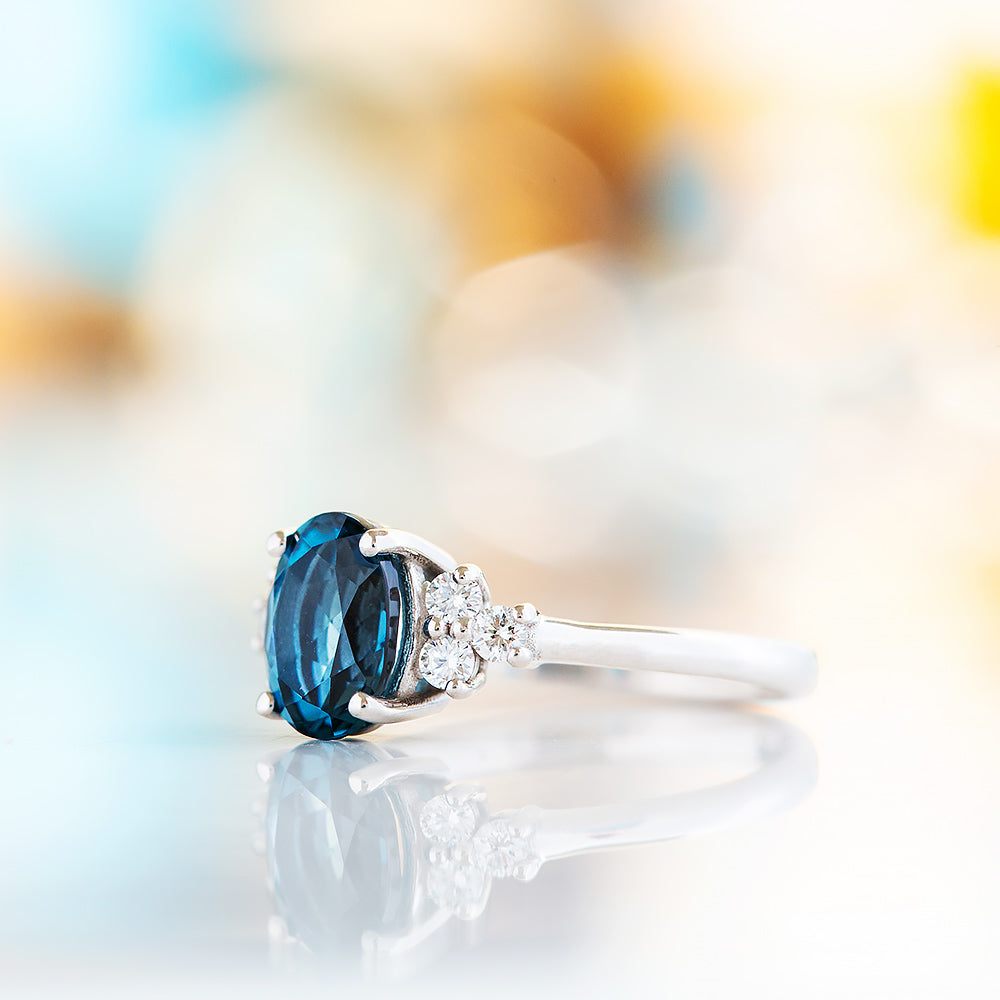 Este, an Oval cut London Topaz and Lab Diamond Ring