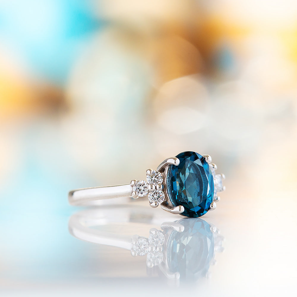 Este, an Oval cut London Topaz and Lab Diamond Ring