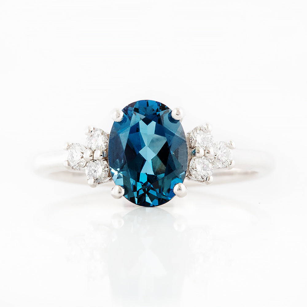 Este, an Oval cut London Topaz and Lab Diamond Ring