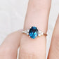 Este, an Oval cut London Topaz and Lab Diamond Ring