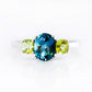 Lucy, a London Blue Topaz and Peridot Trilogy Ring - Victoria's Jewellery