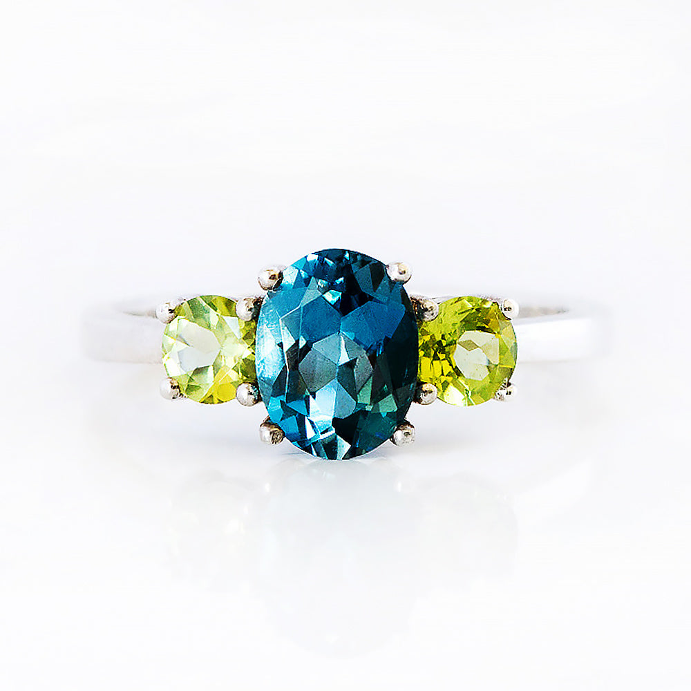 Lucy, a London Blue Topaz and Peridot Trilogy Ring - Victoria's Jewellery