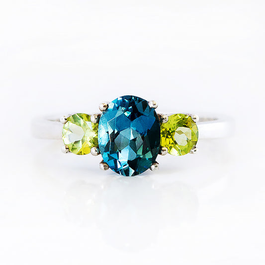 Lucy, a London Blue Topaz and Peridot Trilogy Ring - Victoria's Jewellery
