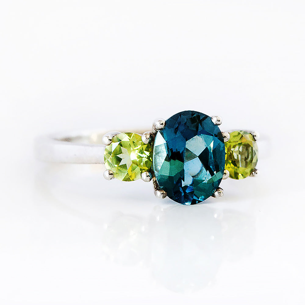 Lucy, a London Blue Topaz and Peridot Trilogy Ring - Victoria's Jewellery