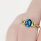 Lucy, a London Blue Topaz and Peridot Trilogy Ring - Victoria's Jewellery