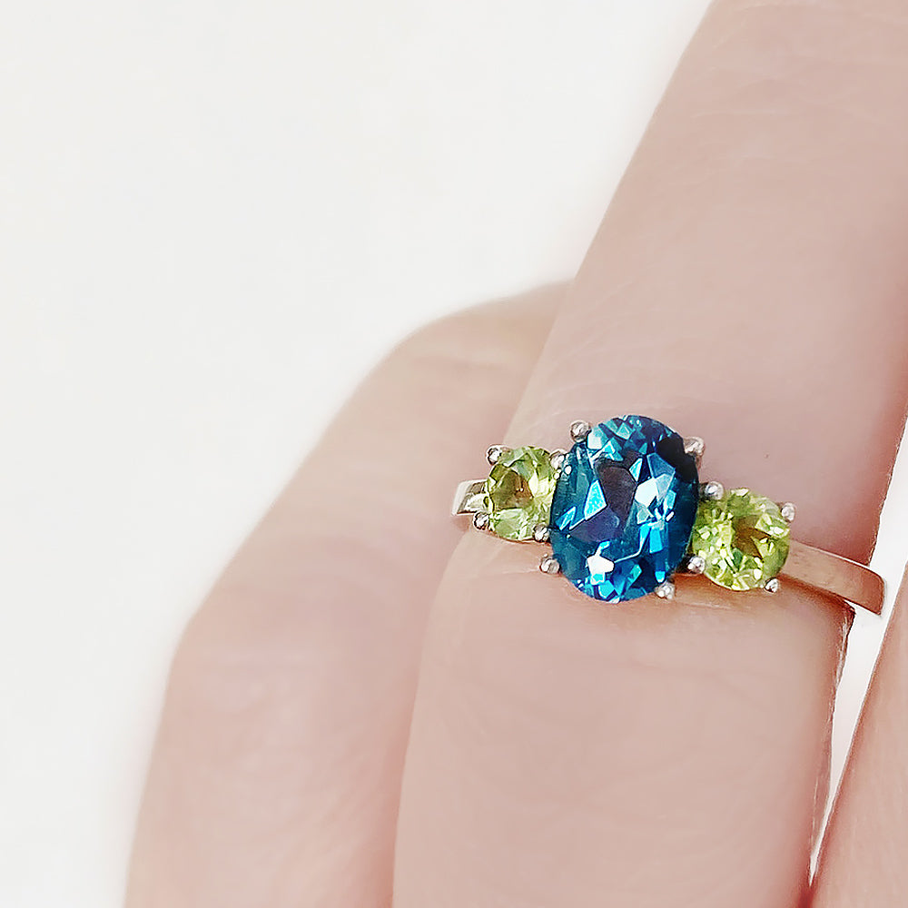 Lucy, a London Blue Topaz and Peridot Trilogy Ring - Victoria's Jewellery